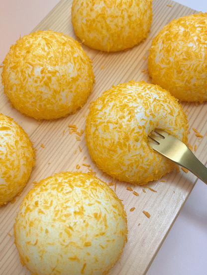 Golden Fried Mochi Bun Stress Toy - Squishy and Delightfully Realistic